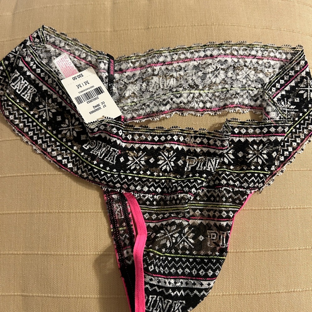 Victoria’s Secret pink thong lace panty M
New with tags